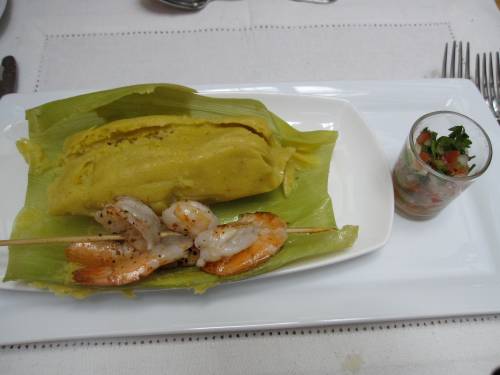Traditional humitas, similar to a tamale and made with fresh corn, onion, basil and butter and served here with sauteed shrimp; Chef Pilar Rodriguez, Santiago