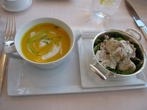 Coconut and pumpkin soup with potato salad